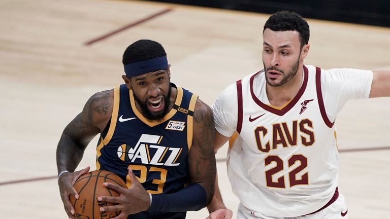 Utah Jazz&#39;s Royce O&#39;Neale (23) drives against Cleveland Cavaliers&#39; Larry Nance Jr. (22) during the first half of an NBA basketball game Tuesday, Jan. 12, 2021, in Cleveland. (AP Photo/Tony Dejak)


