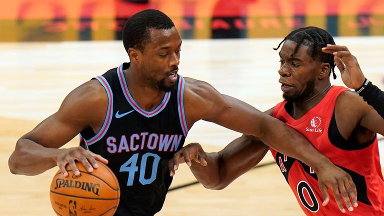 Sacramento Kings forward Harrison Barnes (40) drives into Toronto Raptors guard Terence Davis (0) during the first half of an NBA basketball game Friday, Jan. 29, 2021, in Tampa, Fla. (AP Photo/Chris O&#39;Meara)


