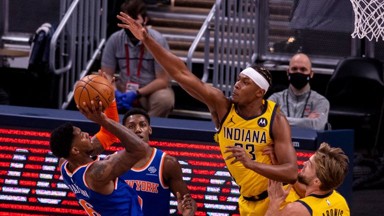 Indiana Pacers forward Myles Turner (33) attempts to block the shot of New York Knicks guard Elfrid Payton (6) during the first half of an NBA basketball game in Indianapolis, Saturday, Jan. 2, 2021. (AP Photo/Doug McSchooler)


