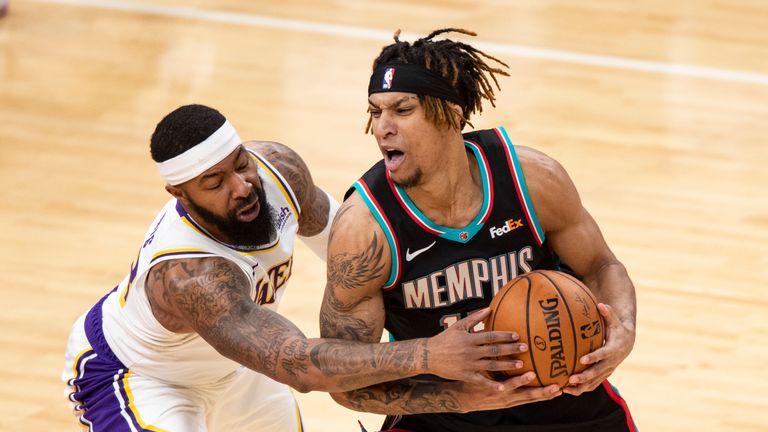 Los Angeles Lakers forward Markieff Morris (88) attempts to steal the ball from Memphis Grizzlies forward Brandon Clarke (15) during the second half of an NBA basketball game Sunday, Jan. 3, 2021, in Memphis, Tenn. (AP Photo/Wade Payne)


