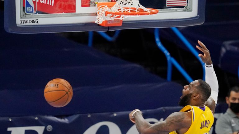 Los Angeles Lakers forward LeBron James (23) dunks in the first half of an NBA basketball game against the Oklahoma City Thunder, Wednesday, Jan. 13, 2021, in Oklahoma City. (AP Photo/Sue Ogrocki)


