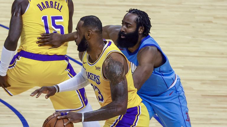 Los Angeles Lakers forward LeBron James (23) drives against Houston Rockets guard James Harden (13) during the second quarter of an NBA basketball game Tuesday, Jan. 21, 2021, in Houston. (Troy Taormina/Pool Photo via AP)


