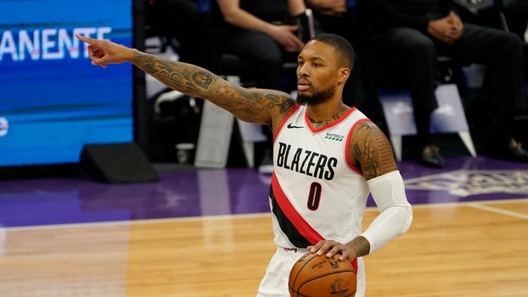 Portland Trail Blazers guard Damian Lillard gestures to teammates during the first quarter of the team&#39;s NBA basketball game against the Sacramento Kings in Sacramento, Calif., Wednesday, Jan. 13, 2021. The Trail Blazers won 132-126. (AP Photo/Rich Pedroncelli)


