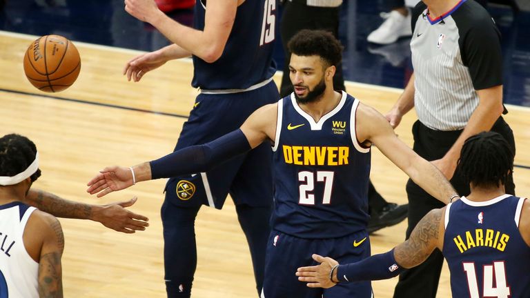 Denver Nuggets Jamal Murray is congratulated by teammates in the second quarter during an NBA basketball game against the Minnesota Timberwolves, Sunday, Jan. 3, 2021, in Minneapolis. (AP Photo/Andy Clayton-King)


