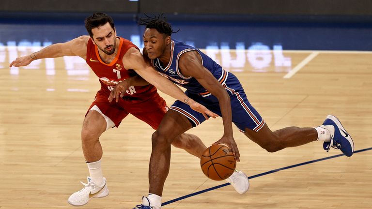 Denver Nuggets&#39; Facundo Campazzo (7) tries to steal the ball from New York Knicks&#39; Immanuel Quickley in the first half of an NBA basketball game Sunday, Jan. 10, 2021, in New York. (Elsa/Pool Photo via AP)


