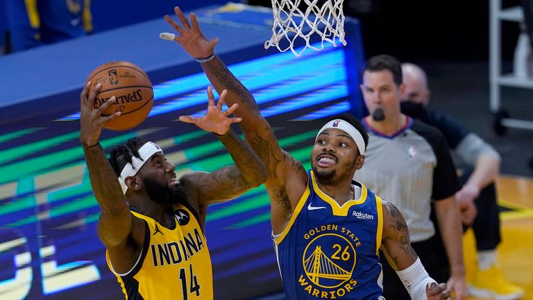 Indiana Pacers forward JaKarr Sampson (14) shoots against Golden State Warriors forward Kent Bazemore (26) during the second half of an NBA basketball game in San Francisco, Tuesday, Jan. 12, 2021. (AP Photo/Jeff Chiu)


