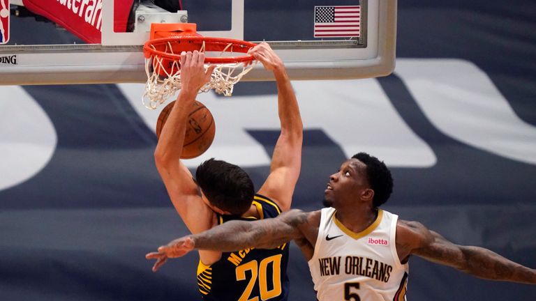 Indiana Pacers forward Doug McDermott (20) slam dunks against New Orleans Pelicans guard Eric Bledsoe (5) in the second half of an NBA basketball game in New Orleans