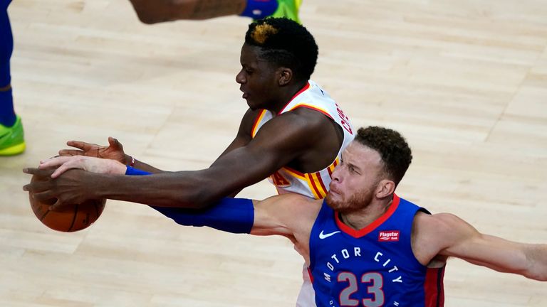 Detroit Pistons forward Blake Griffin (23) and Atlanta Hawks center Clint Capela vie for control of the ball during the second half of an NBA basketball game Wednesday, Jan. 20, 2021, in Atlanta.