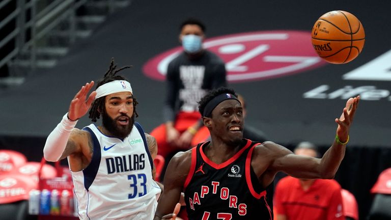 Toronto Raptors forward Pascal Siakam (43) loses the basketball as he tries to drive around Dallas Mavericks center Willie Cauley-Stein (33) during the second half of an NBA basketball game Monday, Jan. 18, 2021, in Tampa, Fla. (AP Photo/Chris O&#39;Meara)


