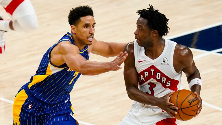 Indiana Pacers guard Malcolm Brogdon (7) defends Toronto Raptors forward OG Anunoby (3) during the second half of an NBA basketball game in Indianapolis, Sunday, Jan. 24, 2021.