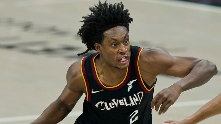 Cleveland Cavaliers&#39; Collin Sexton, left, drives past Brooklyn Nets&#39; Bruce Brown during the first half of an NBA basketball game, Wednesday, Jan. 20, 2021, in Cleveland.