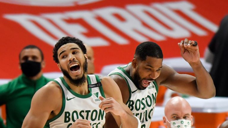 Boston Celtics&#39; Jayson Tatum, left, and Tristan Thompson celebrate after a 122-120 win against the Detroit Pistons in an NBA basketball game, Sunday, Jan. 3, 2021, in Detroit. (AP Photo/Jose Juarez)


