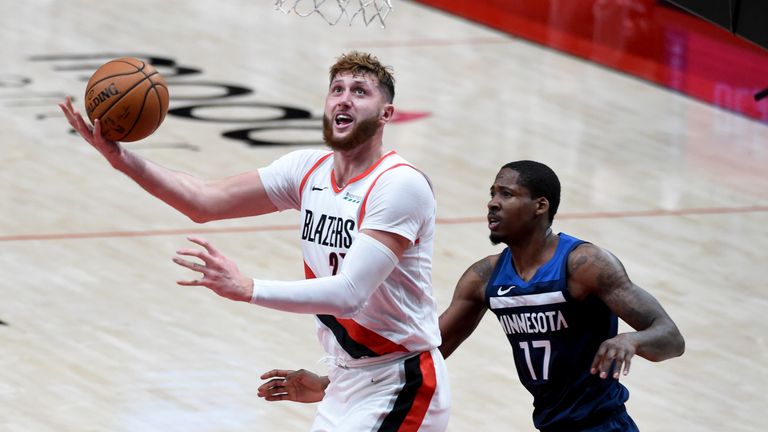 Portland Trail Blazers center Jusuf Nurkic, left, shoots next to Minnesota Timberwolves forward Ed Davis during the second half of an NBA basketball game in Portland, Ore., Thursday, Jan. 7, 2021. (AP Photo/Steve Dykes)


