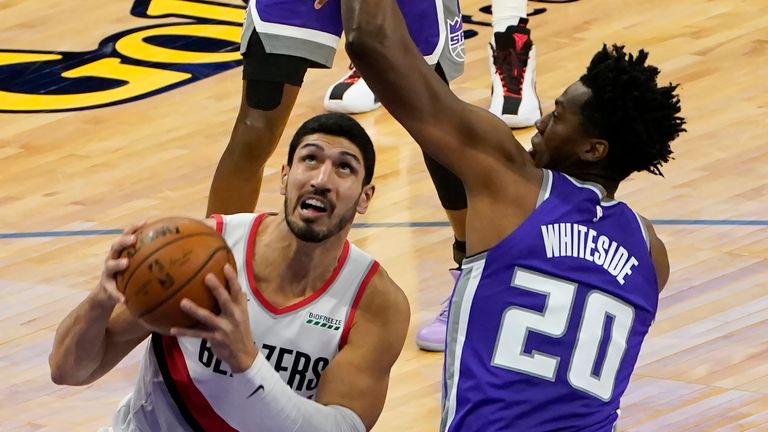 Portland Trail Blazers center Enes Kanter., left, looks to go to the basket against Sacramento Kings center Hassan Whiteside during the second quarter of an NBA basketball game in Sacramento, Calif., Wednesday, Jan. 13, 2021. (AP Photo/Rich Pedroncelli)


