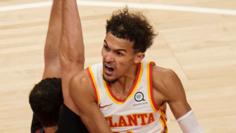 Atlanta Hawks guard Trae Young (11) drives past Cleveland Cavaliers forward Larry Nance Jr. (22) during the first half of an NBA basketball game on Saturday, Jan. 2, 2021 in Atlanta. (AP Photo/Ben Gray)


