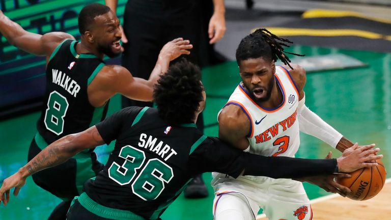 Boston Celtics' Marcus Smart and Kemba Walker defend against New York Knicks' Nerlens Noel