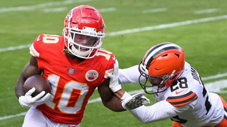 Cleveland Browns cornerback Kevin Johnson (28) tries to push Kansas City Chiefs wide receiver Tyreek Hill (10) out of bounds during the NFL divisional round football game, Sunday, Jan. 17, 2021, in Kansas City, Mo. (AP Photo/Reed Hoffmann)



