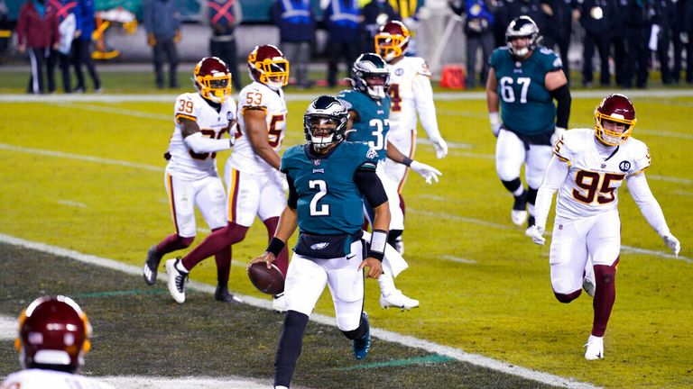 AP- Philadelphia Eagles&#39; Jalen Hurts (2) scores a touchdown during the first half of an NFL football game against the Washington Football Team