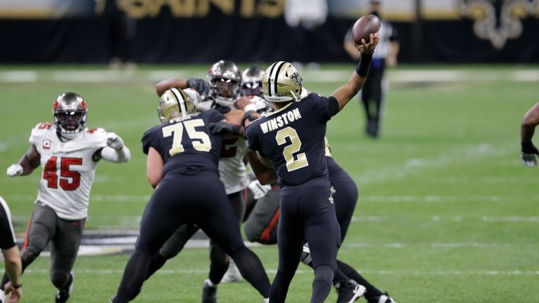 New Orleans Saints quarterback Jameis Winston (2) throws the ball to New Orleans Saints wide receiver Tre&#39;Quan Smith (10) for a touchdown against the Tampa Bay Buccaneers during the first half of an NFL divisional round playoff football game, Sunday, Jan. 17, 2021, in New Orleans. (AP Photo/Brett Duke)


