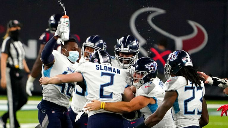 AP - Tennessee Titans kicker Sam Sloman (2) celebrates with teammates after kicking the game-winning field goal against the Houston Texans during the second half 