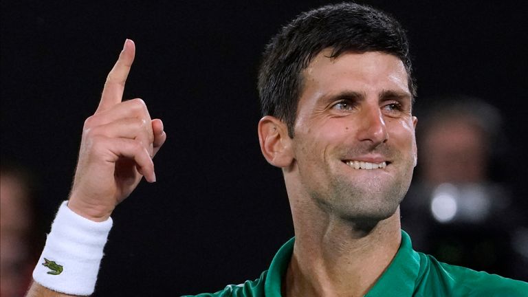 Serbia's Novak Djokovic celebrates after defeating Switzerland's Roger Federer in their semifinal match at the Australian Open tennis championship in Melbourne, Australia. Djokovic is scheduled to play in the U.S. Open, scheduled for Aug. 31-Sept. 13, 2020.
