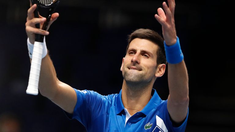 Novak Djokovic of Serbia celebrates winning match point against Alexander Zverev of Germany during their singles tennis match at the ATP World Finals tennis tournament at the O2 arena in London, Friday, Nov. 20, 2020. (AP Photo/Frank Augstein)