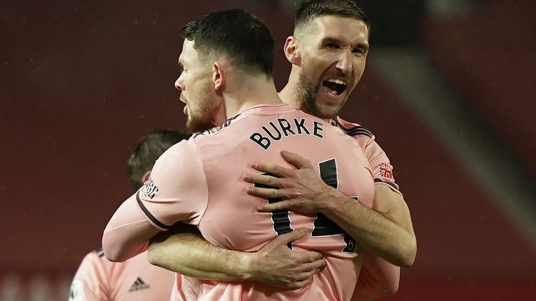 Oliver Burke celebrates with Chris Basham after scoring the winner