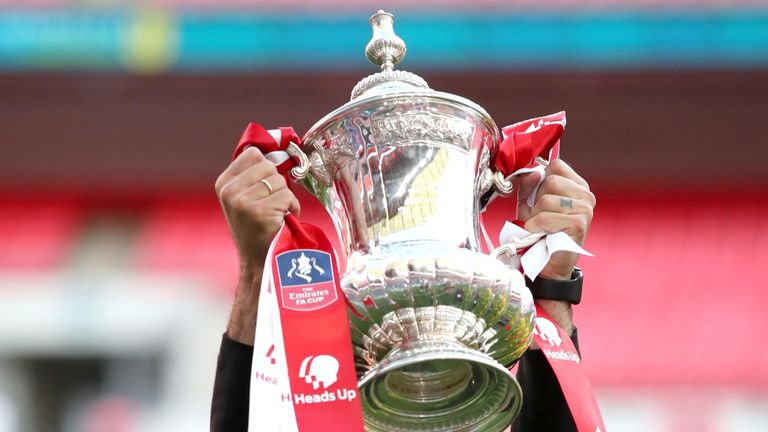 PA - Arsenal boss Mikel Arteta lifts the FA Cup aloft