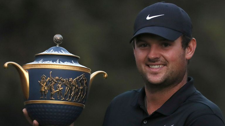 Patrick Reed of the United States poses with the trophy after winning the WGC-Mexico Championship golf tournament, at the Chapultepec Golf Club in Mexico City, Sunday, Feb. 23, 2020. (AP Photo/Fernando Llano)
