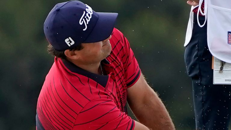 Patrick Reed hits from a bunker toward the 14th hole on the South Course during the final round of the Farmers Insurance Open golf tournament at Torrey Pines, Sunday, Jan. 31, 2021, in San Diego. (AP Photo/Gregory Bull)