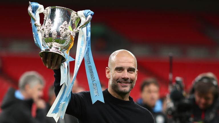 Pep Guardiola lifts the Carabao Cup trophy after Man City's  victory over Aston Villa in March 2020