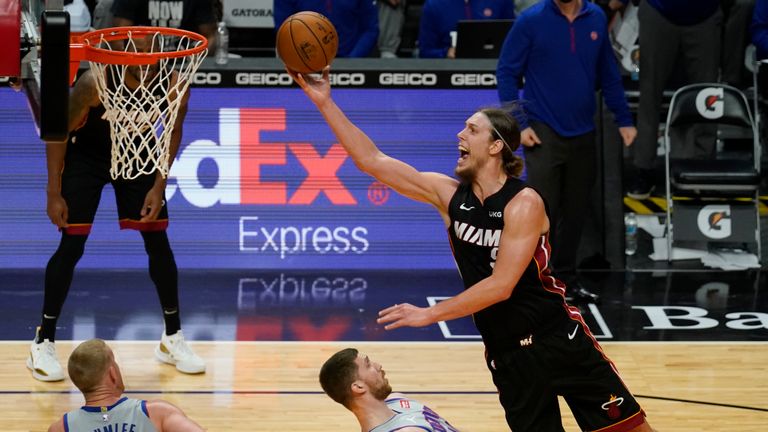 Miami Heat forward Kelly Olynyk (9) drives top the basket over Detroit Pistons guard Svi Mykhailiuk (19) during the second half of an NBA basketball game, Monday, Jan. 18, 2021, in Miami. (AP Photo/Marta Lavandier)


