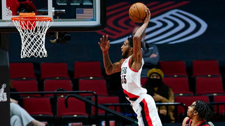 AP - Portland Trail Blazers forward Derrick Jones Jr. dunks against the Chicago Bulls during the second half of an NBA basketball game in Portland