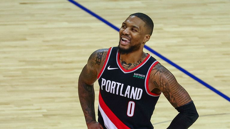 AP - Portland Trail Blazers guard Damian Lillard (0) reacts after a play during the fourth quarter
