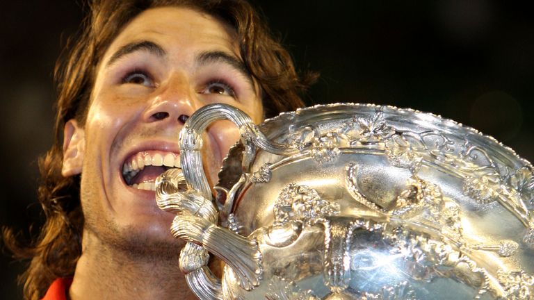 Spain's Rafael Nadal holds the trophy during the awarding ceremony after beating Switzerland's Roger Federer during the Men's singles final match at the Australian Open Tennis Championship in Melbourne, Australia, Sunday, Feb. 1, 2009. (AP Photo/Rick Stevens)