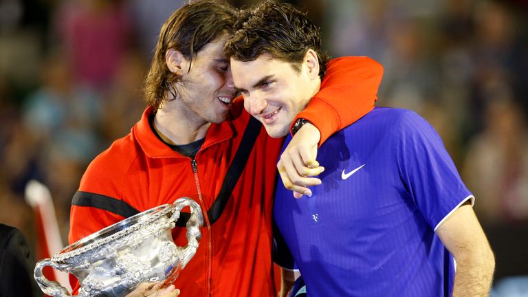 Spain's Rafael Nadal, left, hugs Switzerland's Roger Federer during the awarding ceremony after winning the Men's singles final match at the Australian Open Tennis Championship in Melbourne, Australia, Sunday, Feb. 1, 2009. (AP Photo/Rob Griffith)