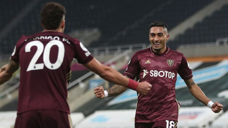 Raphinha celebrates his goal with Rodrigo (AP)