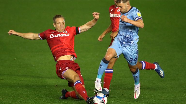 Coventry City's Matt Godden (right) and Reading's Michael Morrison battle for the ball during the Sky Bet Championship match at St Andrews, Birmingham.