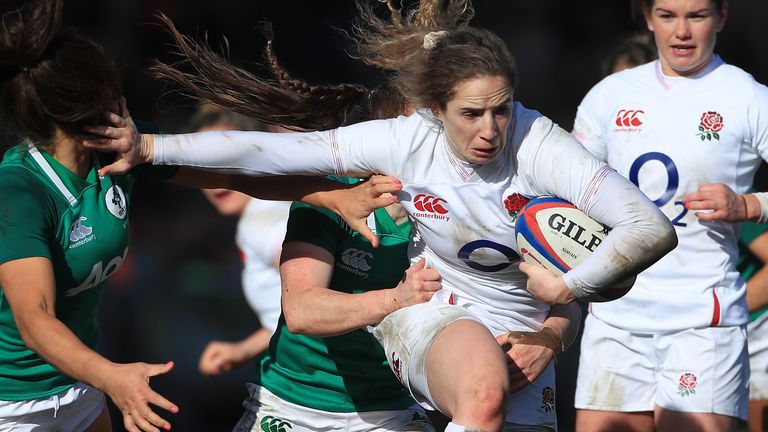 Abby Dow attempts to escape the attentions of Ireland pair Sene Naoupu and Clair Keohane