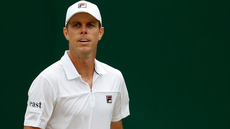 Sam Querrey reacts after winning a point against Australia's John Millman in a Men's singles match during day six of the Wimbledon Tennis Championships in London, Saturday, July 6, 2019.