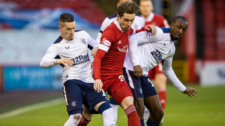 Rangers' Ryan Kent and Glen Kamara (right) battle with Aberdeen's Scott Wright 