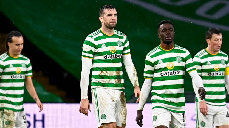 The Celtic players look dejected after conceding late on in the contest