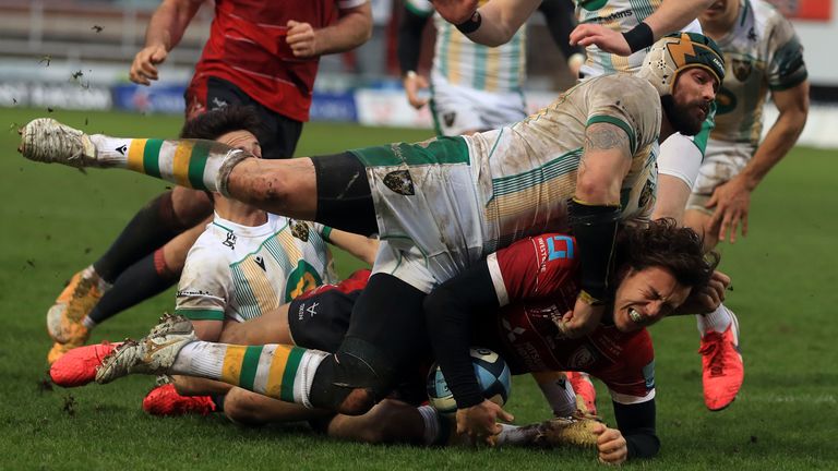 Gloucester v Northampton Saints - Gallagher Premiership - Kingsholm Stadium
Gloucester's Lloyd Evans is tackled by Northampton Saints' Shaun Adendorff (top) during the Gallagher Premiership match at Kingsholm Stadium, Gloucester. Picture date: Saturday January 30, 2021.