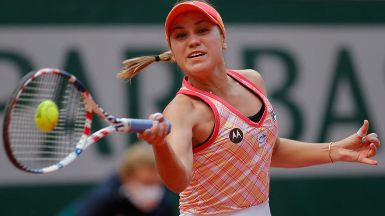 Sofia Kenin, of the United States, plays a shot against Poland's Iga Swiatek in the final match of the French Open tennis tournament at the Roland Garros stadium in Paris, France. Kenin is the top-seeded woman in Abu Dhabi, where the first women’s tour-level tennis event of 2021 begins main-draw play on Wednesday, Jan. 6, 2021.