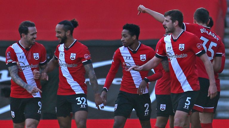 Southampton players celebrate their first goal of the goal scored by Arsenal's Gabriel