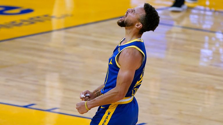Golden State Warriors guard Stephen Curry reacts after a 3-point shot against the Los Angeles Clippers