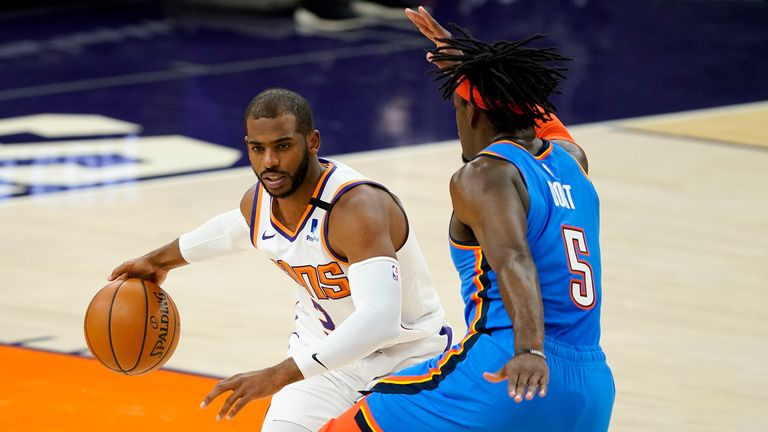 Phoenix Suns guard Chris Paul drives past Oklahoma City Thunder forward Luguentz Dort