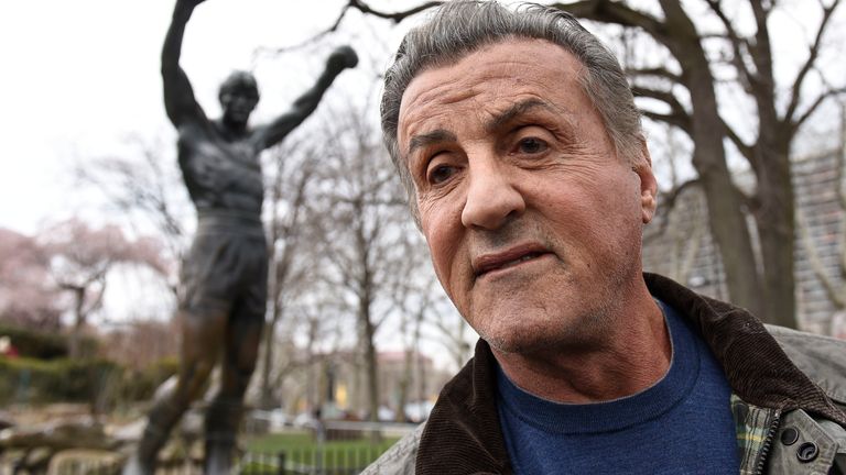 Sylvester Stallone talks to reports in front of the Rocky statue for a "Creed II" photo op, Friday, April 6, 2018, in Philadelphia. The film, part of the "Rocky" film franchise, will be released later this year. (AP Photo/Michael Perez)