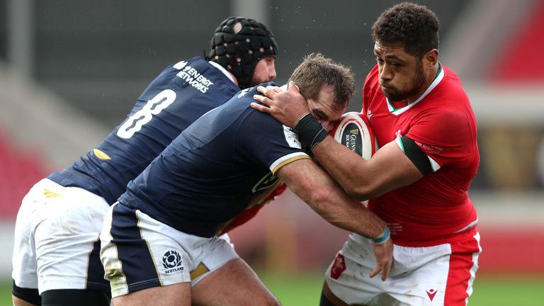 Wales' Taulupe Faletau (right) is tackled by Scotland's Blade Thomson (left) and Fraser Brown during the Guinness Six Nations match at Parc y Scarlets, Llanelli.