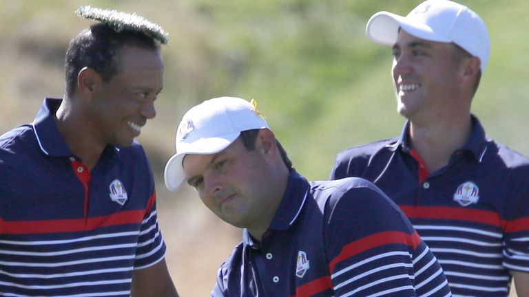 Tiger Woods of the US places the cover of a water sprinkler as he jokes with Patrick Reed, center, and Justin Thomas, right, during a practice round of the Ryder Cup at Le Golf National in Saint-Quentin-en-Yvelines, outside Paris, France, Thursday, Sept. 27, 2018. The 42nd Ryder Cup will be held in France from Sept. 28-30, 2018 at Le Golf National. (AP Photo/Francois Mori)..